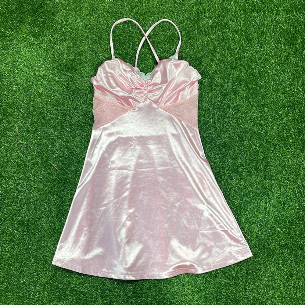 Pink satin negligee with lace trim and lace side detail.